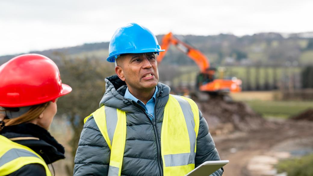 A survey crew working in the South West of England on groundworks of a green field site