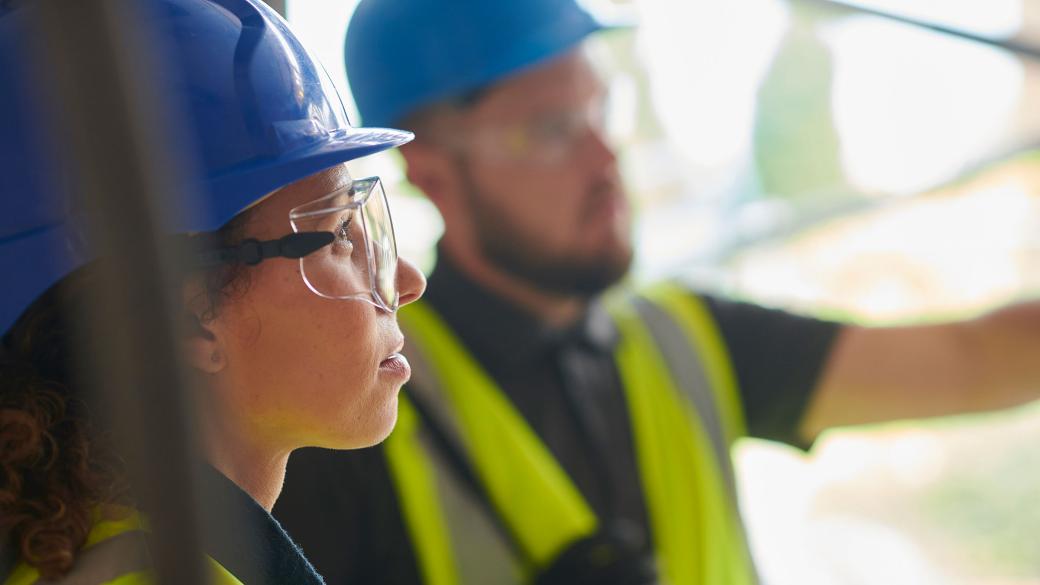 Building contractor chatting to architect