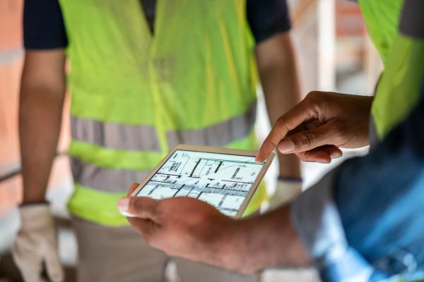 Construction workers viewing plans on an ipad