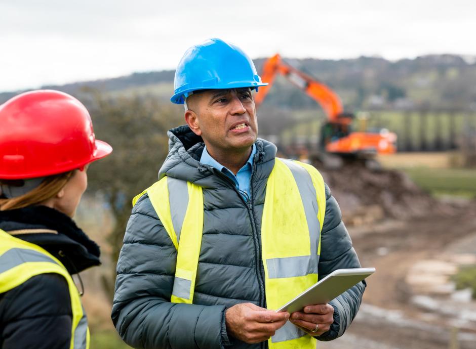 A survey crew working in the South West of England on groundworks of a green field site