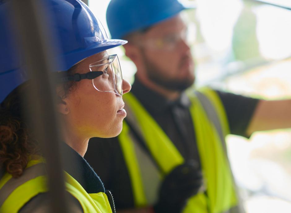 Building contractor chatting to architect