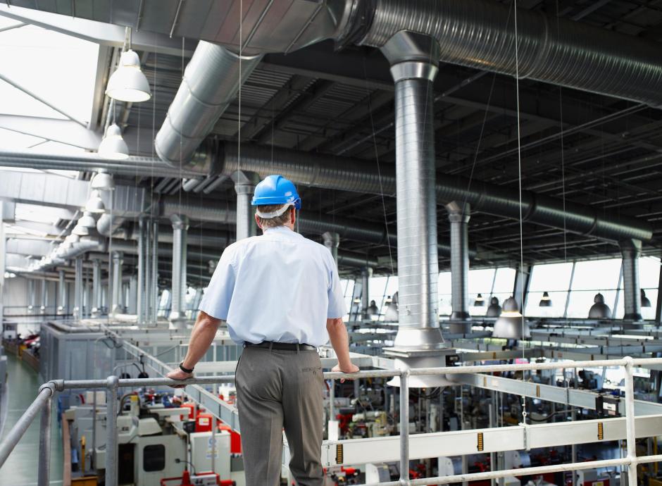 Factory owner inspecting factory floor